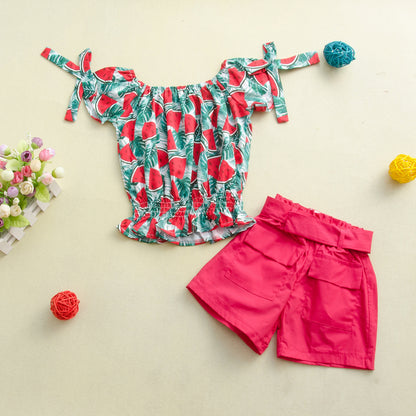 Two-piece children's suit with solid color shorts